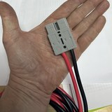 Anderson-style plug held in the hand for size